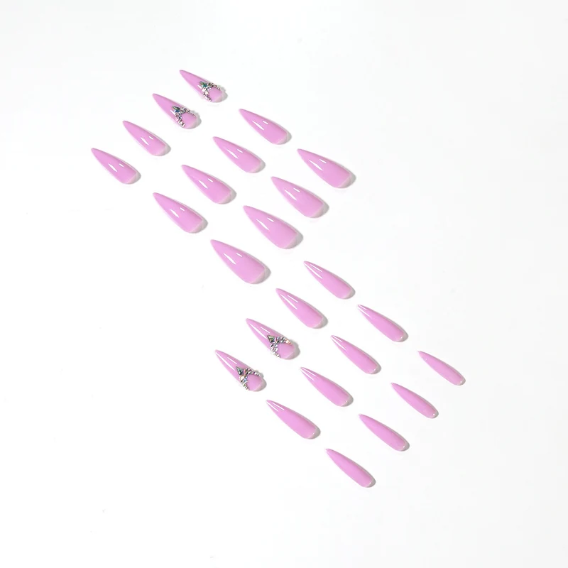 Glamorous stiletto nails with rhinestone decoration Stornfield