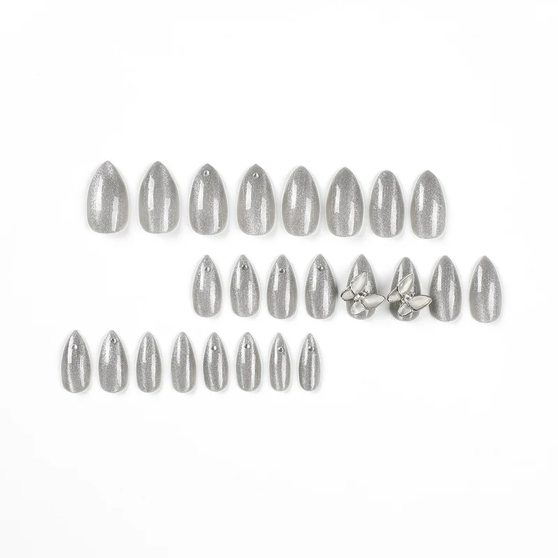 Glamorous stiletto nails with radiant glitter and elegant 3D design Stornfield