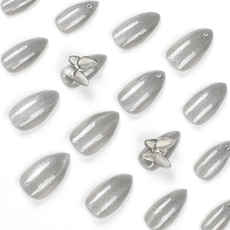 Glamorous stiletto nails with radiant glitter and elegant 3D design Stornfield