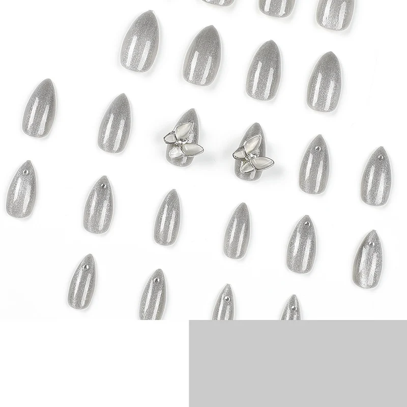 Glamorous stiletto nails with radiant glitter and elegant 3D design Stornfield