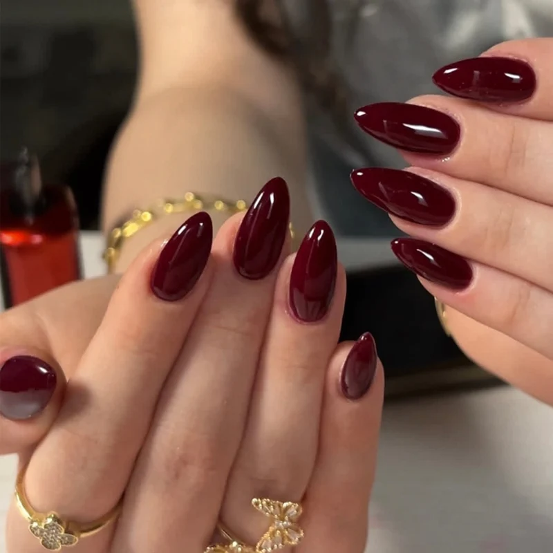 Glamorous stiletto nails with high gloss and elegant design accents Stornfield