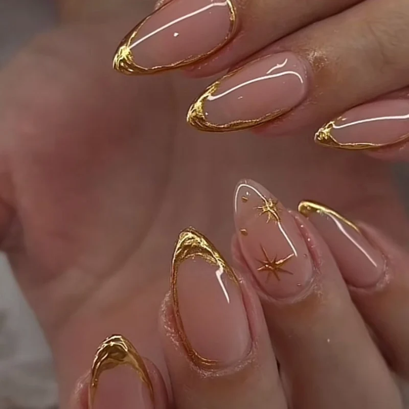 Glamorous stiletto nails with golden accents Stornfield