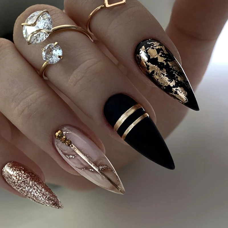 Glamorous stiletto nails with golden accents Stornfield
