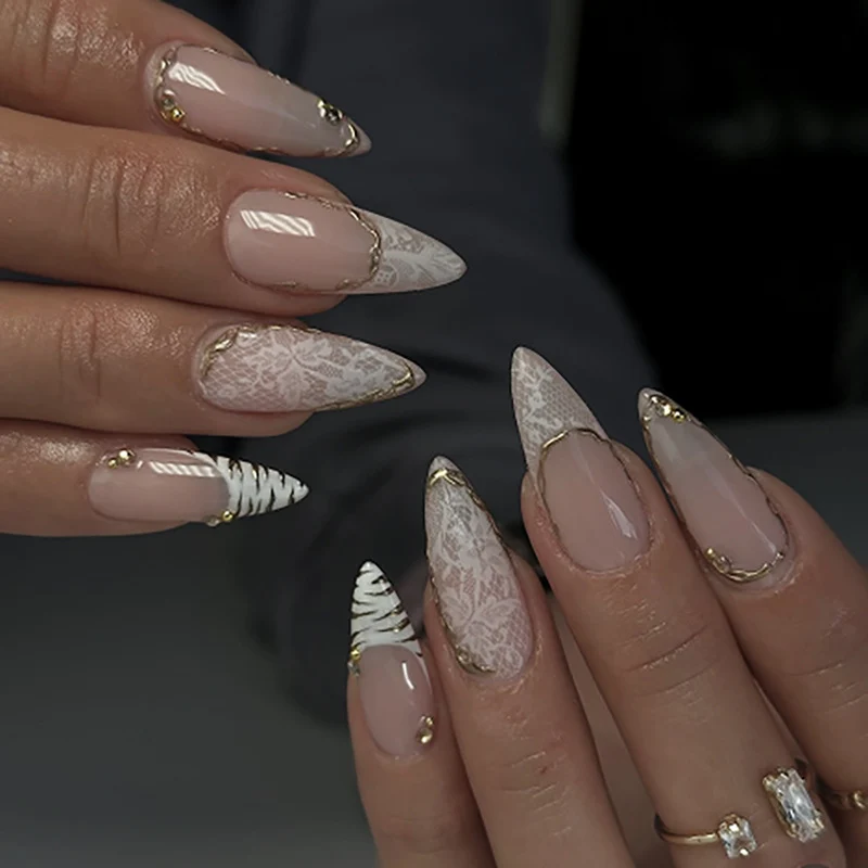 Glamorous stiletto nails with elegant star design Stornfield