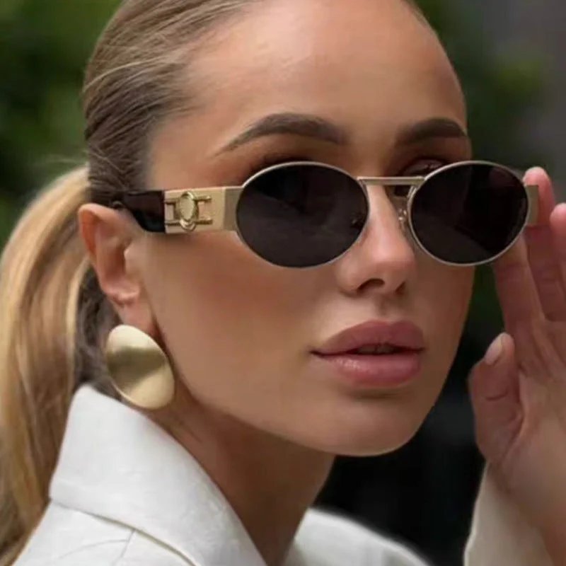 Dame rund solbrille med moderne metallramme og UV-beskyttelse Luvikno