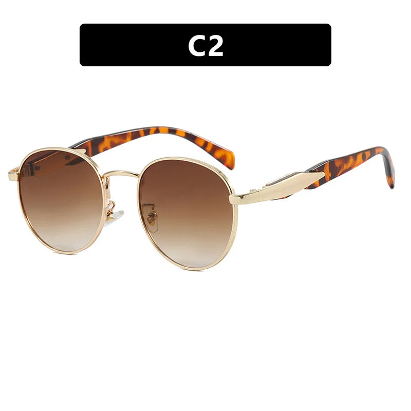 Dame rund solbrille med elegant, gyllen ramme og UV-beskyttelse Luvikno