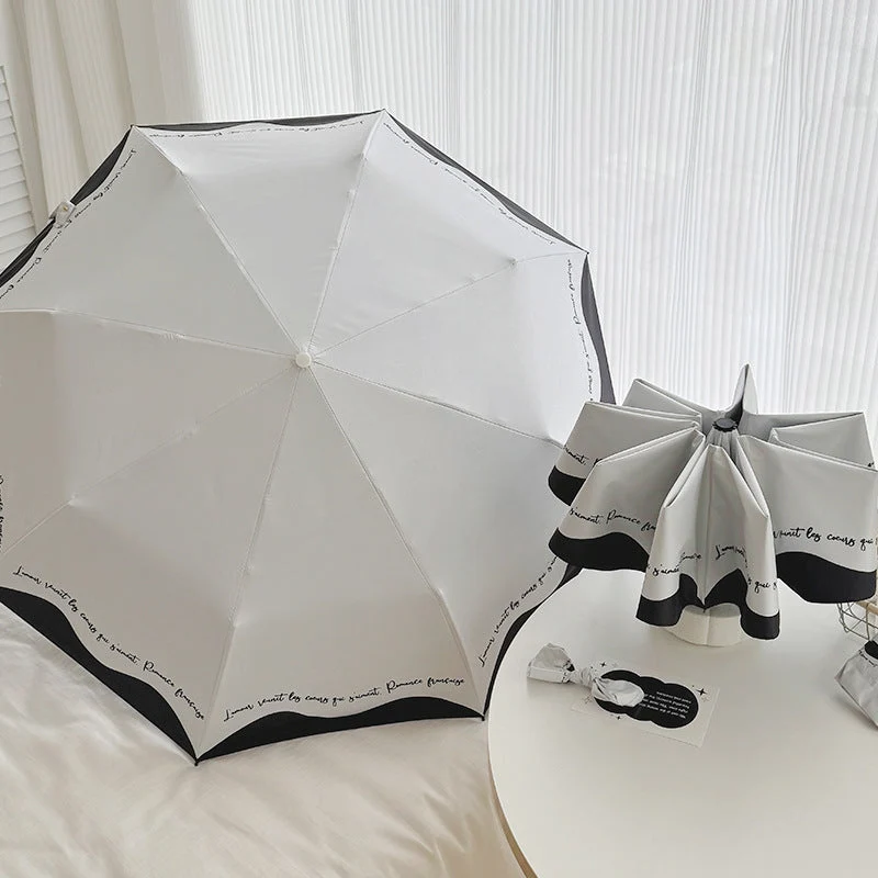 Dame sammenleggbar paraply med stilfull design og praktisk lagringssystem Luvikno