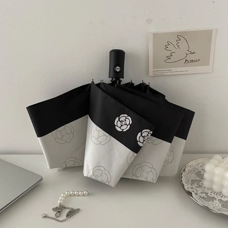 Dame elegant paraply med stilfullt blomsterdesign Luvikno