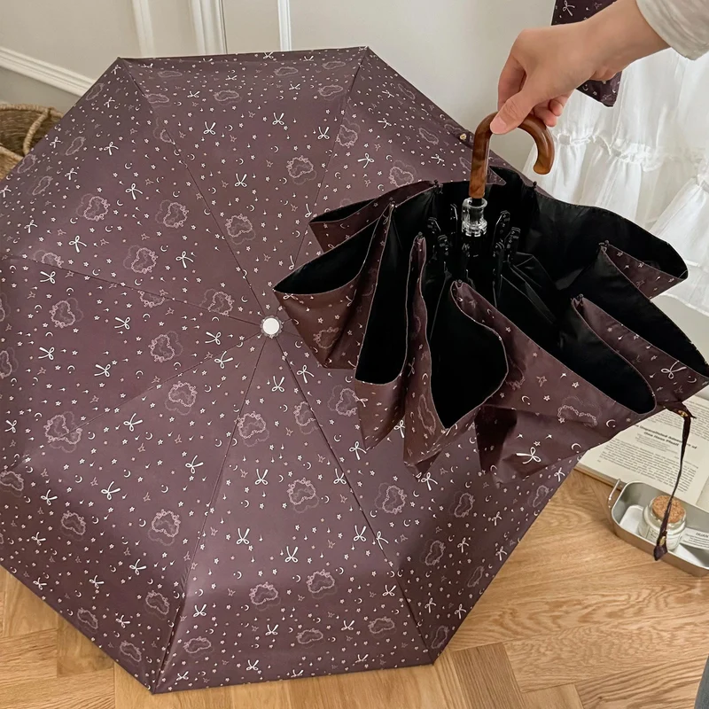 Dame sammenleggbart regnparaply med elegant anhengdesign Luvikno