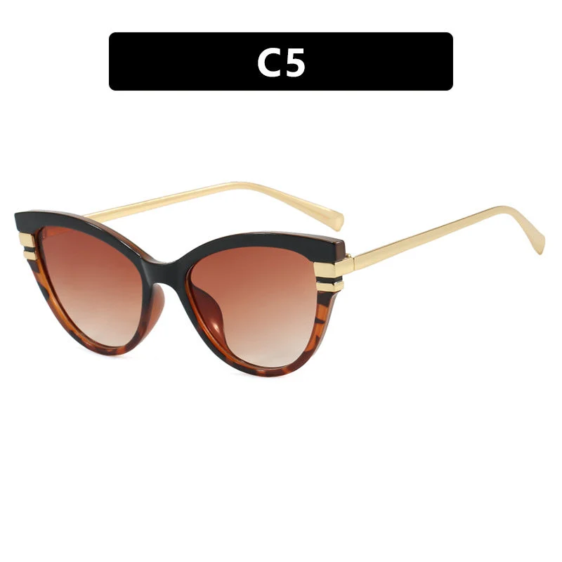 Dame Cat-Eye solbriller med elegant plastramme og gullaccentuer Luvikno