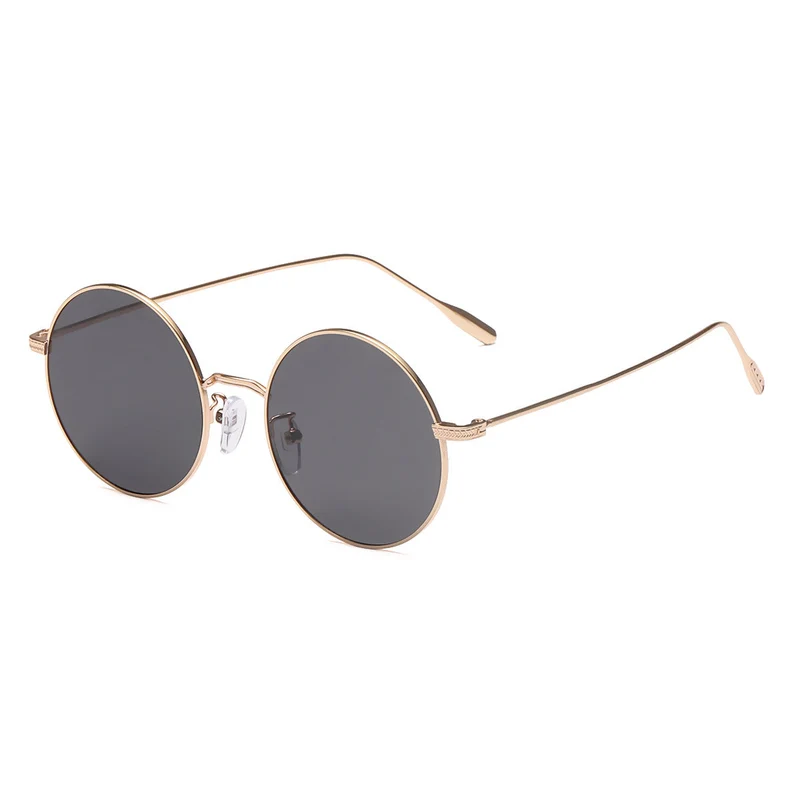 Dame rund solbrille med elegant metallramme og polarisert glass Luvikno