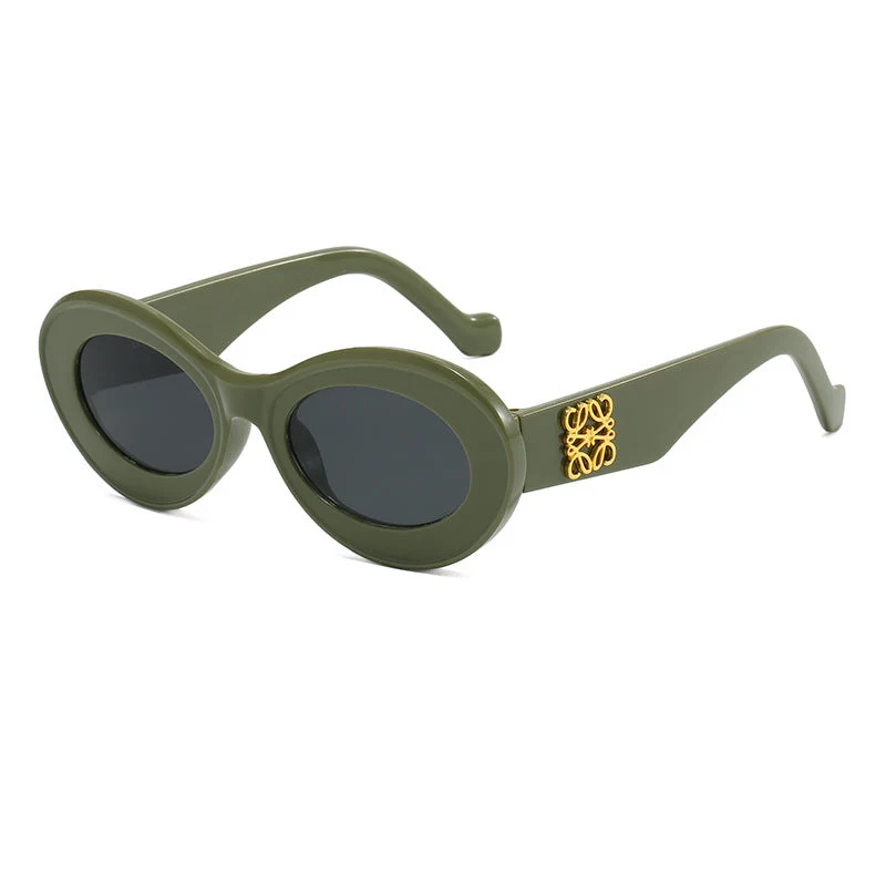 Dame moteriktig solbrille med oval ramme og gullapplikasjoner Luvikno