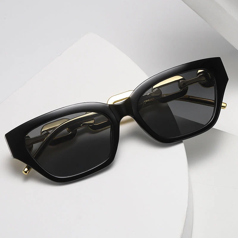 Dame Cat-Eye solbrille med dekorativ kjettingramme Luvikno