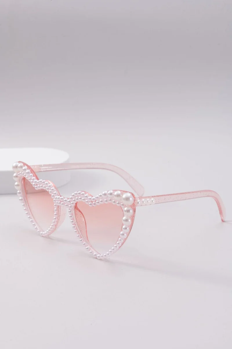 Dame designer solbrille med perleinnramming fra Luvikno