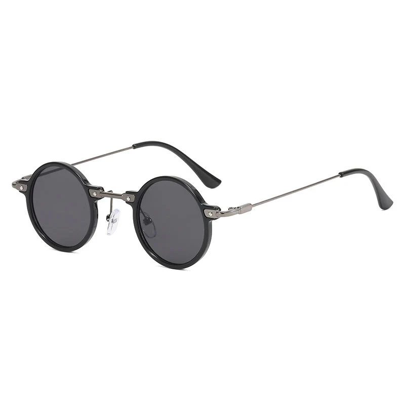 Dame rund solbrille med moderne metallramme og store blå linser Luvikno