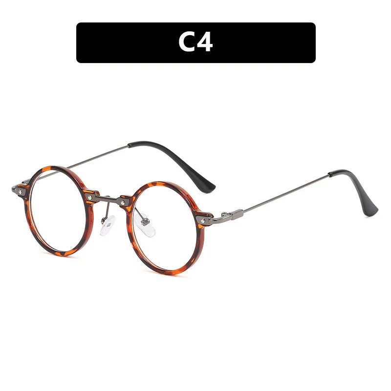 Dame rund solbrille med moderne metallramme og store blå linser Luvikno