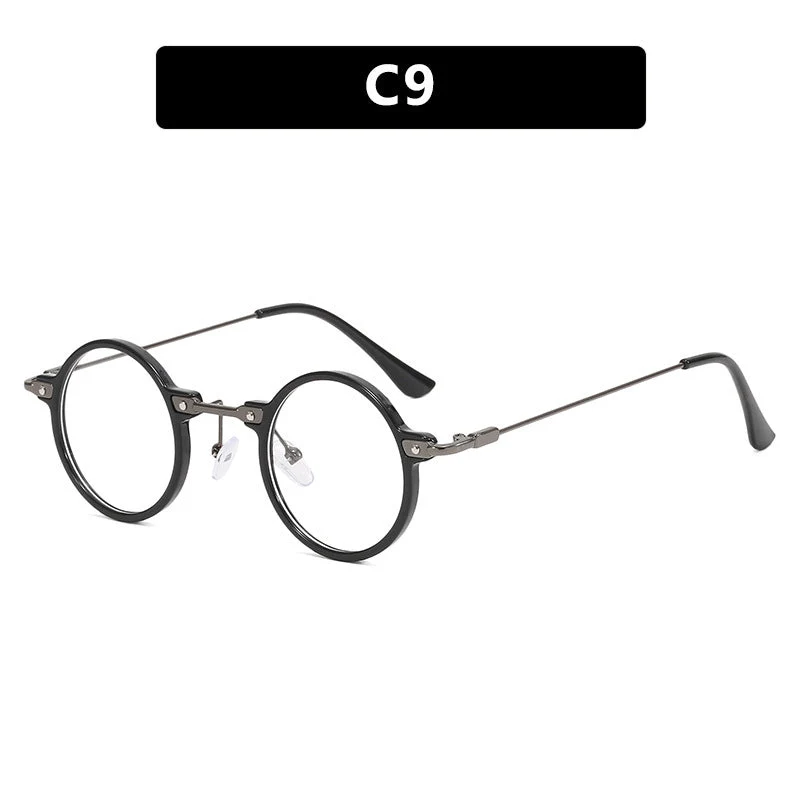 Dame rund solbrille med moderne metallramme og store blå linser Luvikno