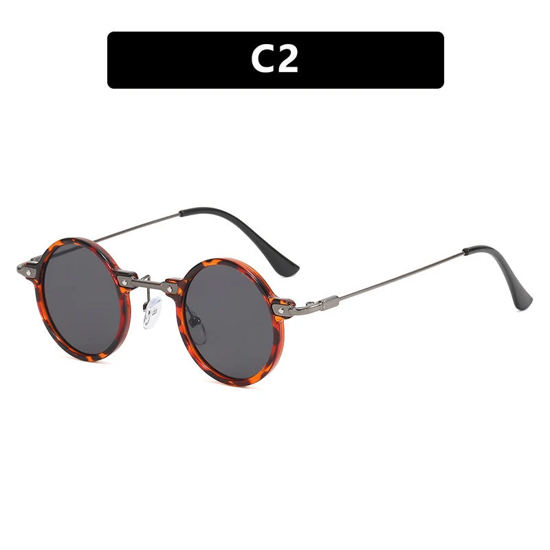 Dame rund solbrille med moderne metallramme og store blå linser Luvikno