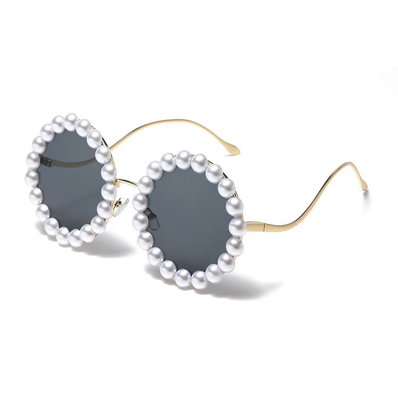 Dame designer-solbrille med perlebesatt ramme Luvikno
