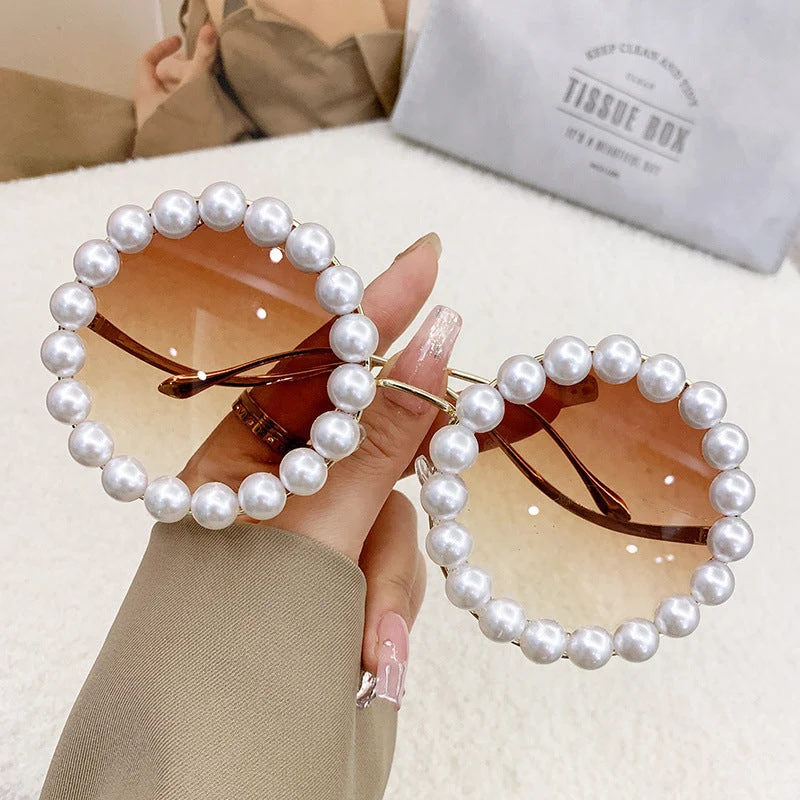 Dame designer-solbrille med perlebesatt ramme Luvikno