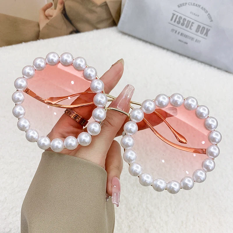 Dame designer-solbrille med perlebesatt ramme Luvikno