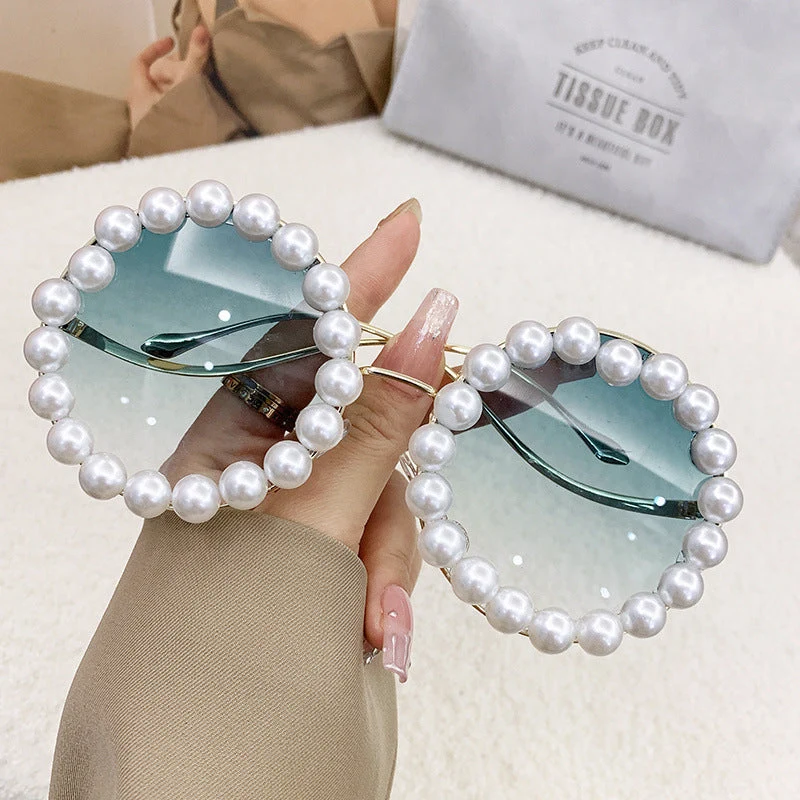 Dame designer-solbrille med perlebesatt ramme Luvikno