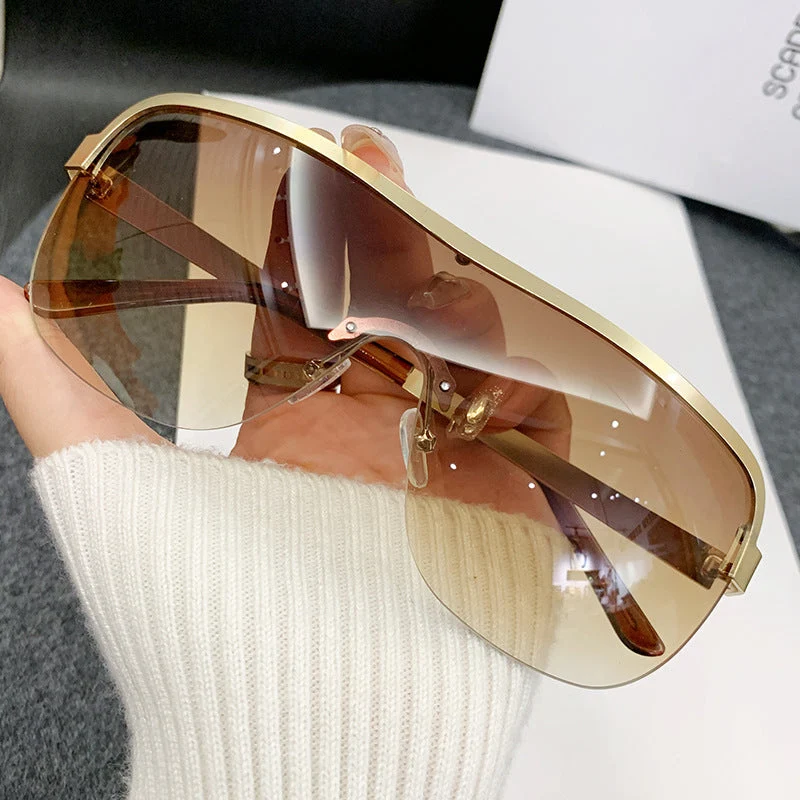Dame futuristisk solbrille med elegant minimalistisk design Luvikno