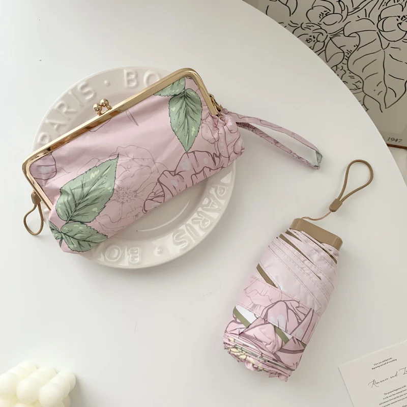 Damer elegant foldeparaply med blomsterdesign og praktisk etui Luvikno