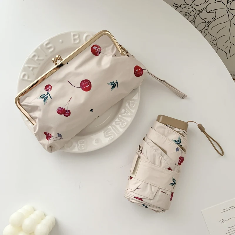 Damer elegant foldeparaply med blomsterdesign og praktisk etui Luvikno
