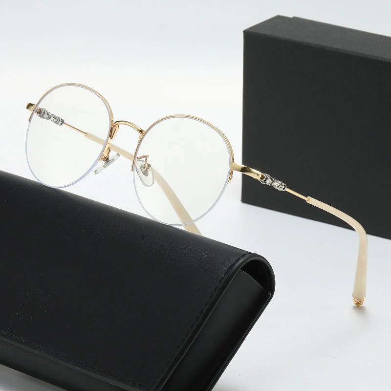 Dame rund solbrille med elegant metallramme og komfortable nesepads Luvikno