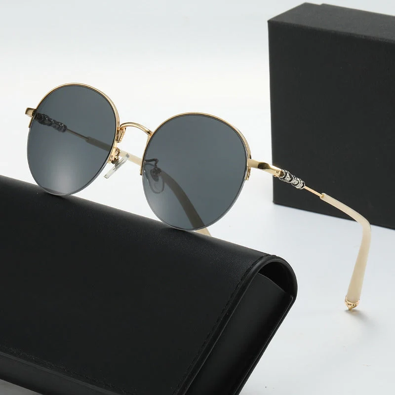 Dame rund solbrille med elegant metallramme og komfortable nesepads Luvikno