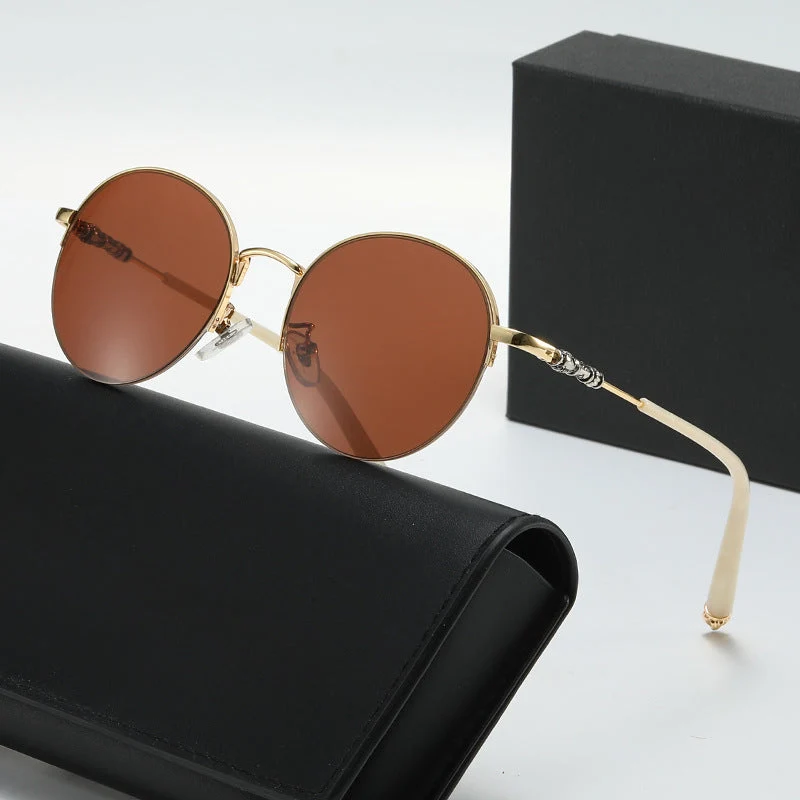Dame rund solbrille med elegant metallramme og komfortable nesepads Luvikno
