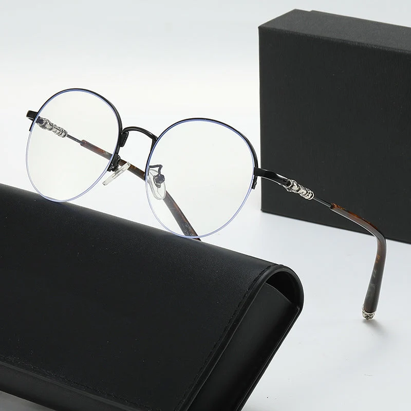 Dame rund solbrille med elegant metallramme og komfortable nesepads Luvikno