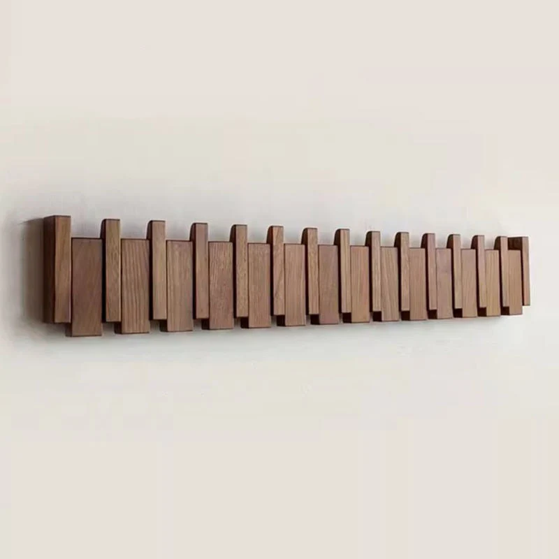 Tre vegghenger i piano design med sammenleggbare kroker | Luvikno