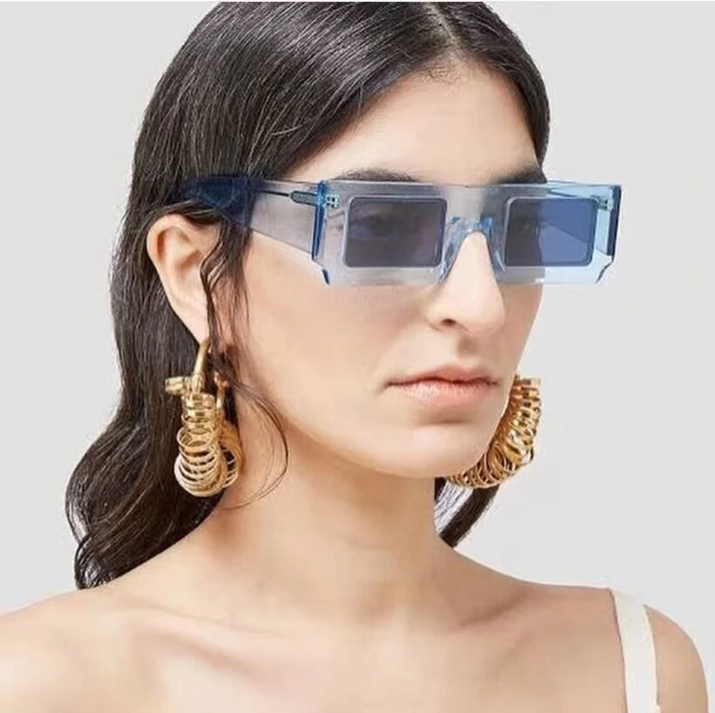 Dame statement solbrille med kvadratisk ramme og futuristisk design Luvikno
