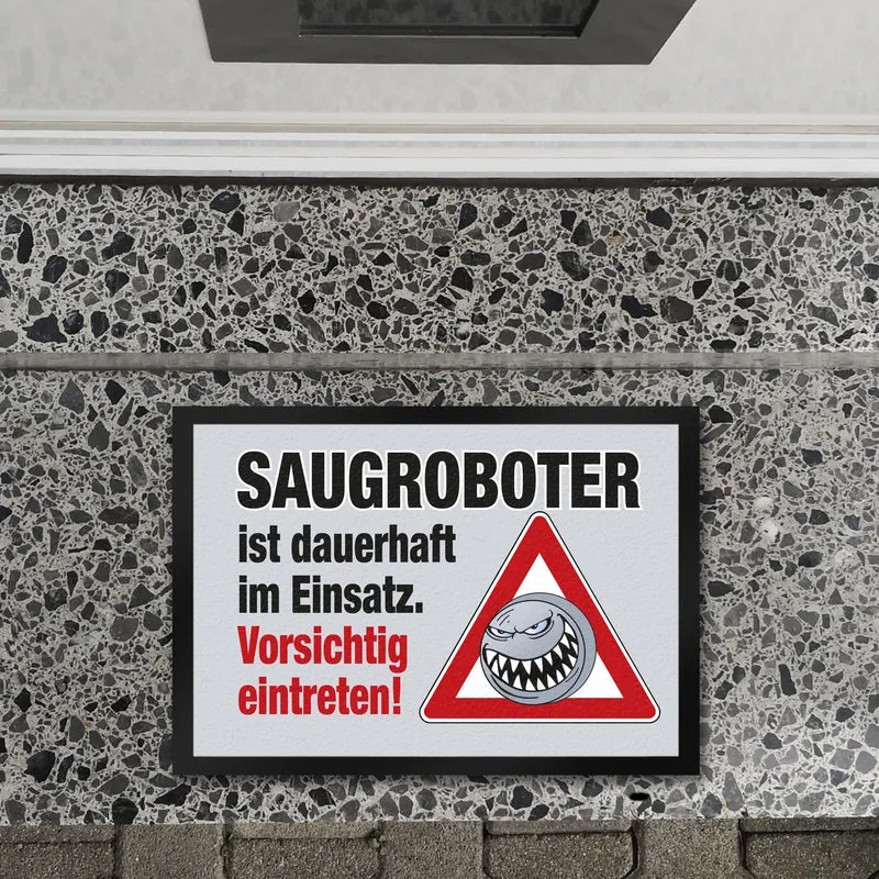 Saugroboter im Einsatz Fußmatte mit Spruch Vorsichtig eintreten!