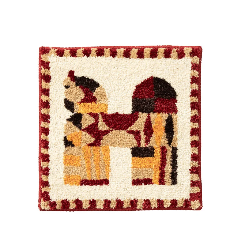 Hand-tufted square decor bath mat with animal motif and non-slip back Stornfield