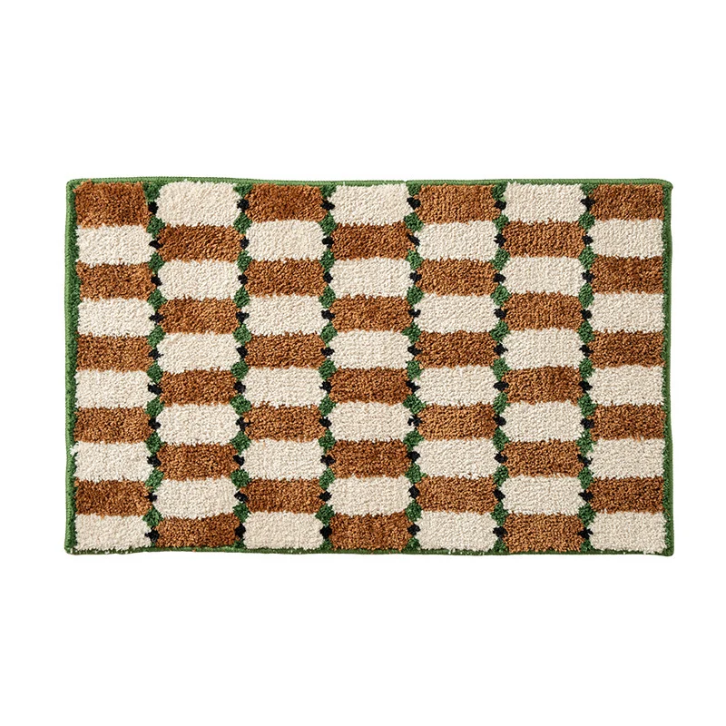 Hand-tufted bathroom mat with a velvety pile, non-slip latex backing, and geometric honeycomb check pattern Stornfield