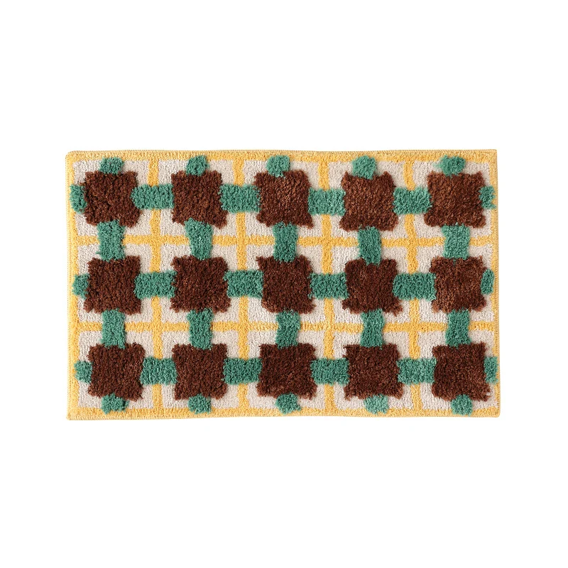 Hand-tufted bathroom bath mat with non-slip backing and textured square relief Stornfield