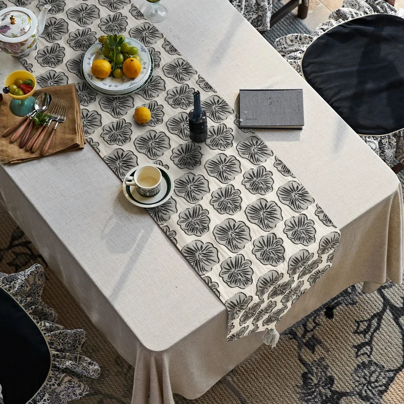 Woven double-sided linen table runner with tassels and hand-drawn swallow print Stornfield