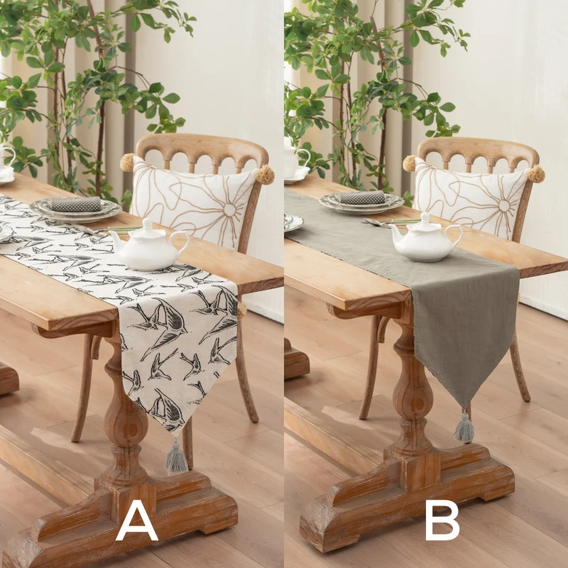 Woven double-sided linen table runner with tassels and hand-drawn swallow print Stornfield