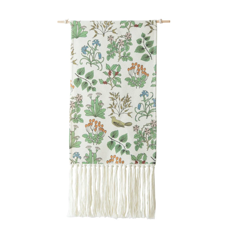 Woven wall hanging with floral jacquard structure and long fringes Stornfield
