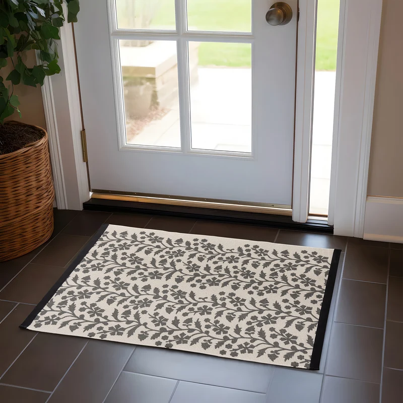 Woven table runner with floral vinyl print look and reinforced overlock stitching Stornfield