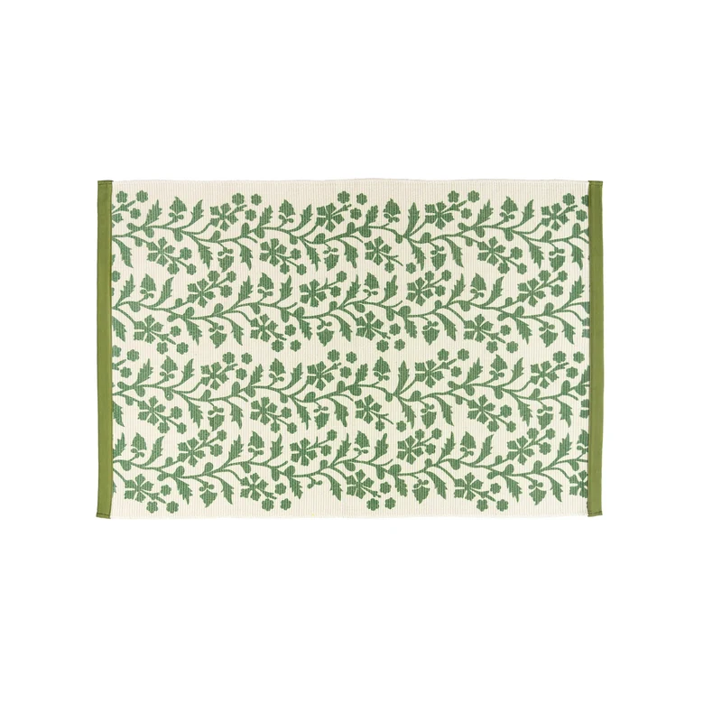 Woven table runner with floral vinyl print look and reinforced overlock stitching Stornfield