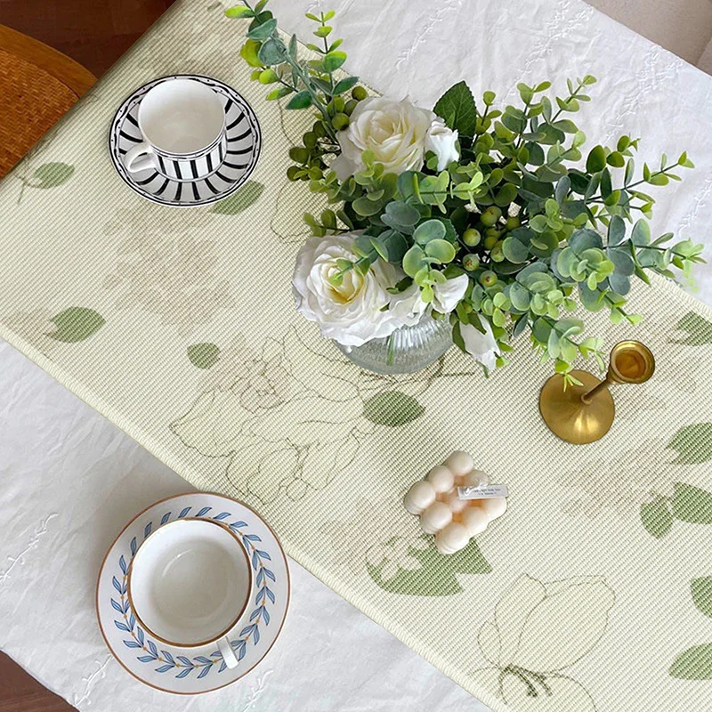 Woven table runner with floral jacquard pattern and fringed edge Stornfield