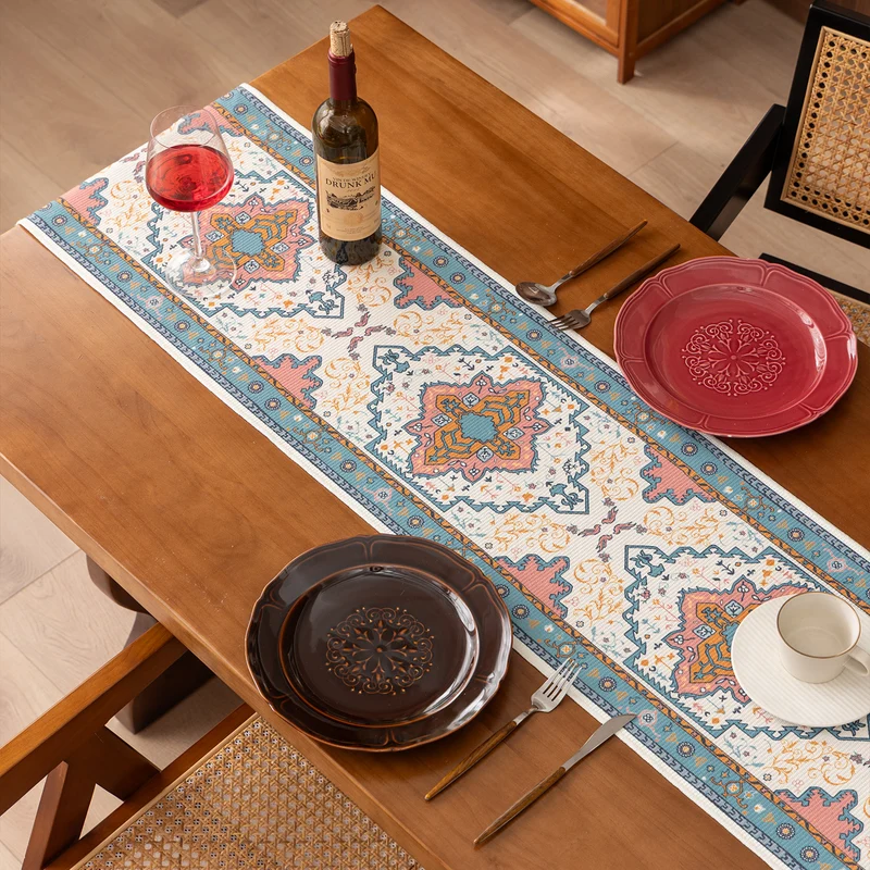 Woven table runner made of cotton blend with oriental medallion pattern and fringes Stornfield