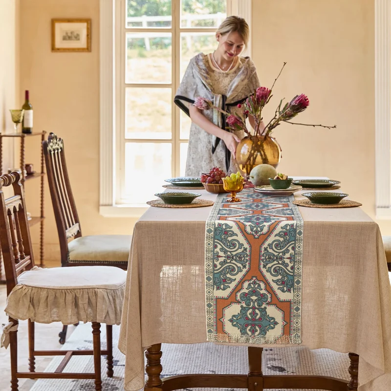 Woven table runner made of cotton blend with oriental medallion pattern and fringes Stornfield