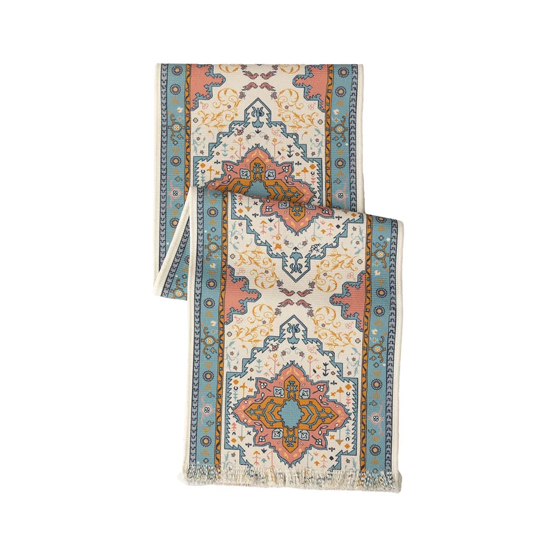 Woven table runner made of cotton blend with oriental medallion pattern and fringes Stornfield