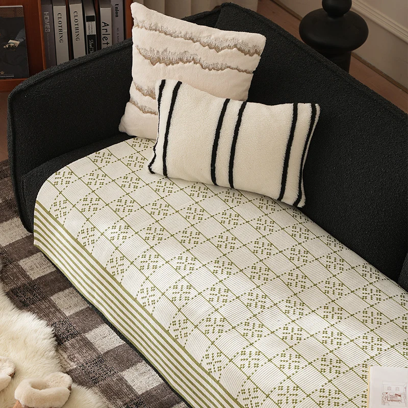 Woven rectangular table runner made of cotton blend with checkered pattern and striped border Stornfield