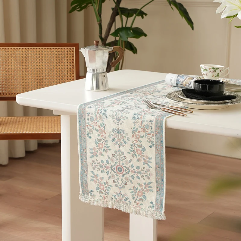 Woven jacquard table runner with floral medallion and fringes Stornfield